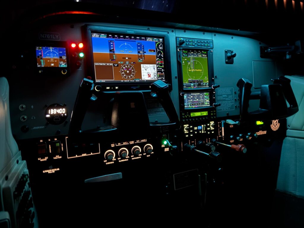 A Cessna 210 cockpit with a custom Superior instrument panel and illuminated E.L.S.T. legends