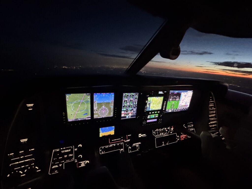A Beechcraft Duke cockpit at dusk with Superior E.L.S.T. illuminated panel legends